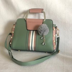 Lovely sea green and amaranth pink leather bag